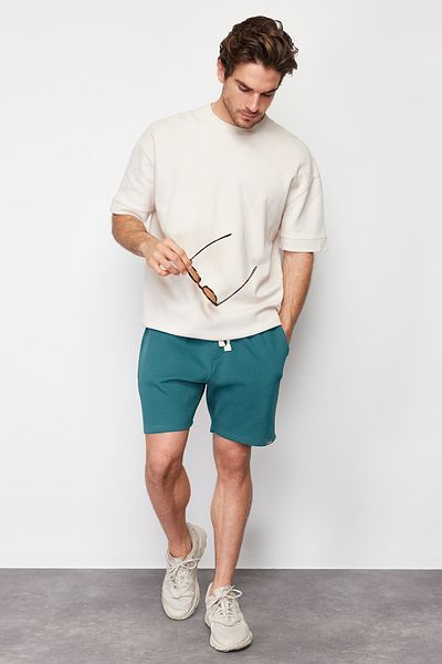 Kolekcia Trendyol Smaragdovo zelené bavlnené šortky – Regular Fit TMNSS24SR00022